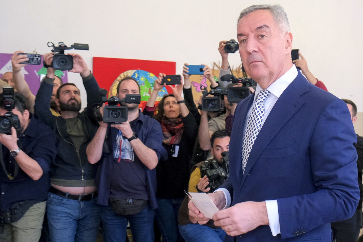 Pro-Western incumbent Milo Djukanovic prepares to vote at a polling station in Montenegro's capital Podgorica, Sunday, April 2, 2023. Montenegrins are casting ballots on Sunday in a runoff presid ...