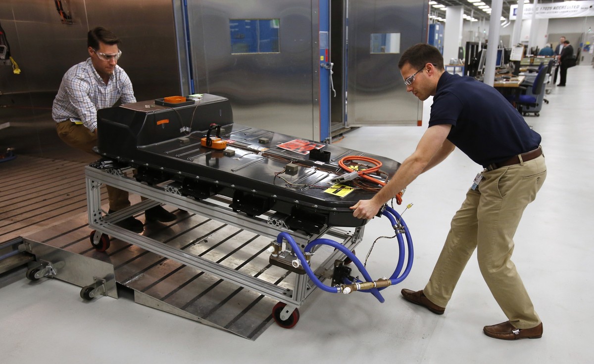 FILE- In this Nov. 4, 2016, file photo, a Chevrolet Bolt EV battery pack is removed for testing after undergoing charging and discharging cycles at General Motors Warren Technical Center's Advanc ...