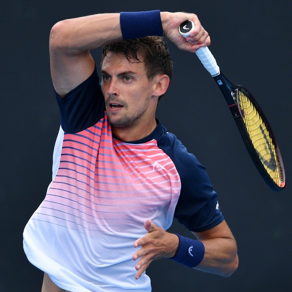 epa09665486 Henri Laaksonen of Switzerland in action during their match against Rinky Hijikata of Australia on Day 2 of the Melbourne Summer Set tennis tournament at Melbourne Park in Melbourne, Austr ...