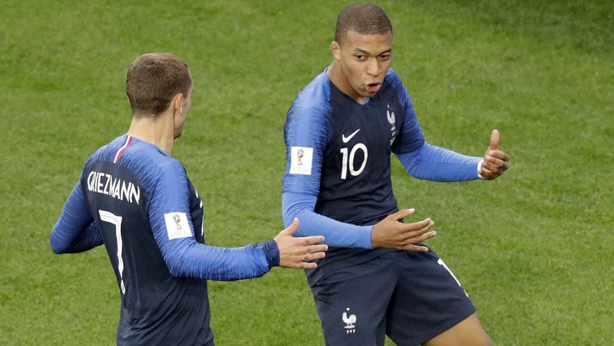 France&#039;s Kylian Mbappe celebrates after scoring the opening goal with teammate France&#039;s Antoine Griezmann, left, during the group C match between France and Peru at the 2018 soccer World Cup ...