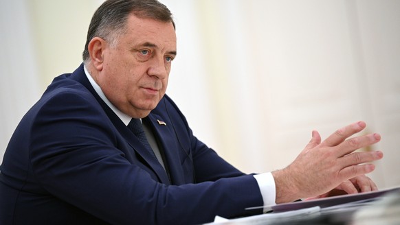 Bosnian Serb leader Milorad Dodik gestures as he speaks to Russian President Vladimir Putin during their meeting at the Kremlin in Moscow, Russia. in Moscow, Russia, Tuesday, May 23, 2023. (Alexey Fil ...