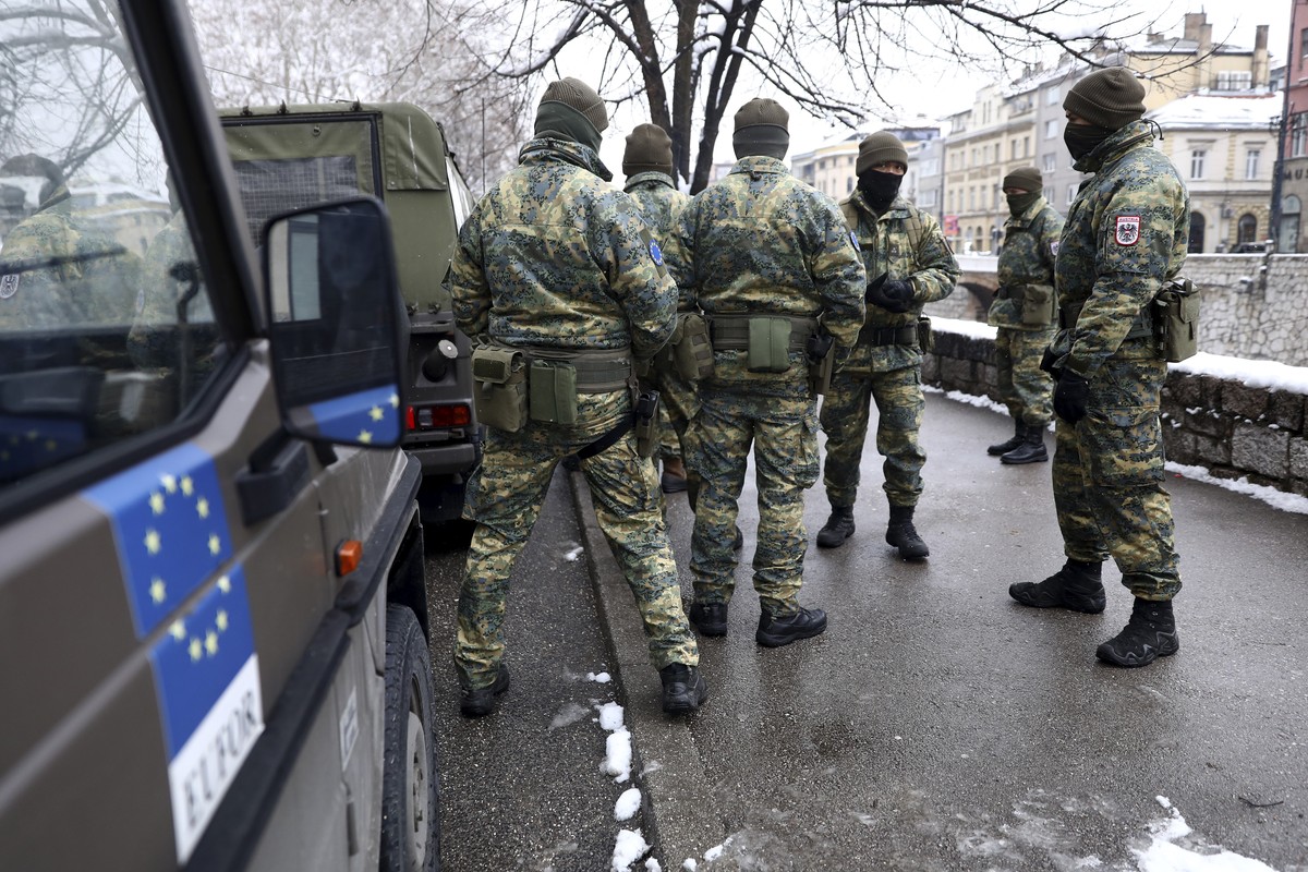 Austrian NATO peacekeeping EUFOR troops stop as they patrol in downtown Sarajevo, Bosnia, Monday March 7, 2022. For some European countries watching Russia's bloody invasion of Ukraine, there are ...