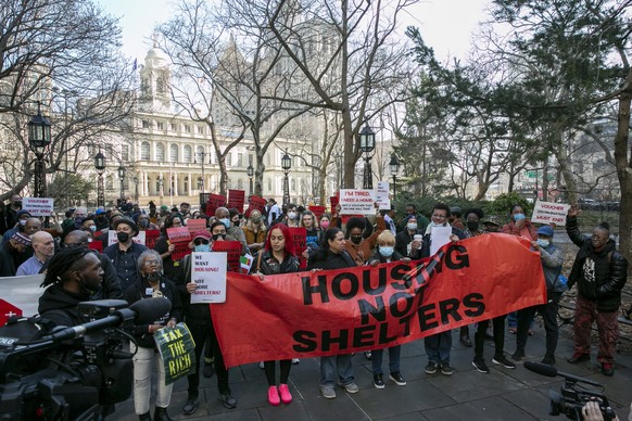 epa09834284 Protesters gather outside City Hall to raise their concerns about homelessness, the NYC shelter system and lack of available housing while the New York City Council debated its annual budg ...