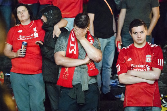 Liverpool Fans look disappointed on the Marketplace in Basel after the UEFA Europa League final between England&#039;s Liverpool FC and Spain&#039;s Sevilla Futbol Club at the St. Jakob-Park stadium i ...