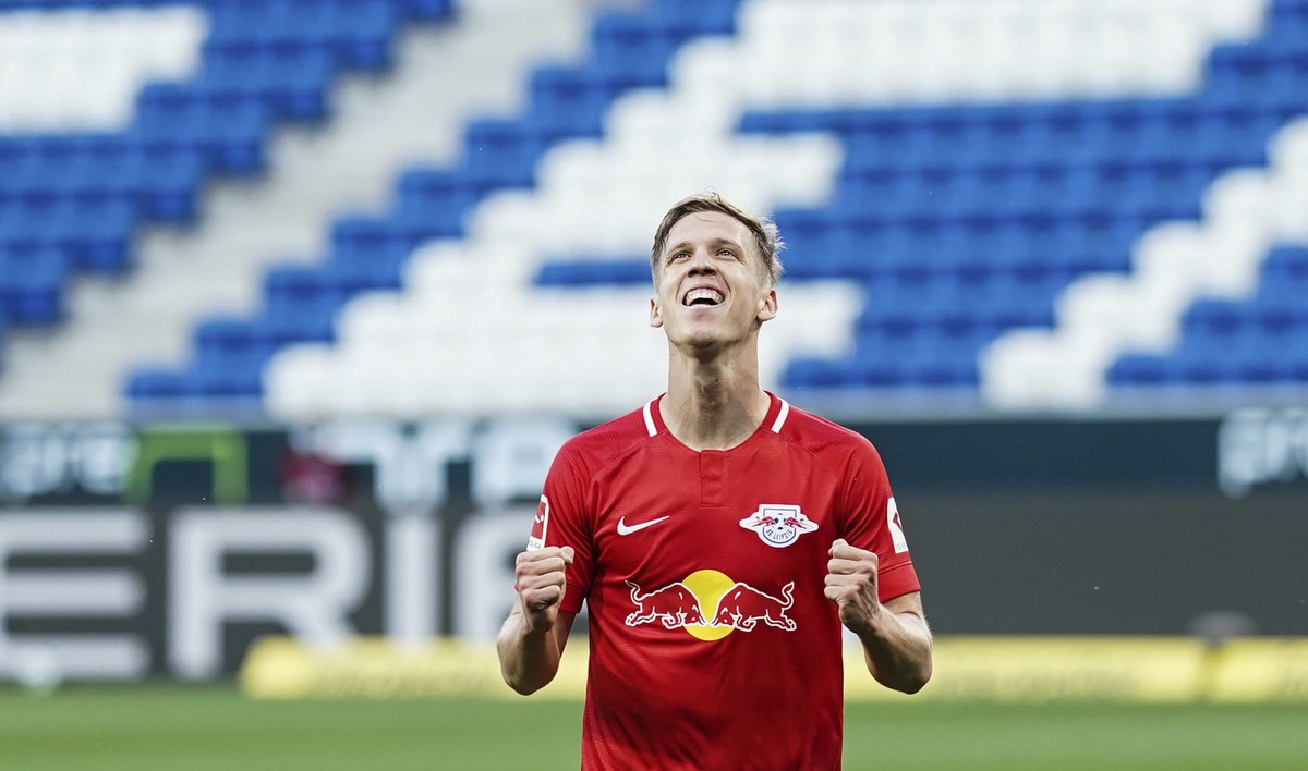 Leipzig's Dani Olmo celebrates after scoring his side's second goal during the German Bundesliga soccer match between 1899 Hoffenheim and RB Leipzig in Sinsheim, Germany, Friday, June 12, 20 ...