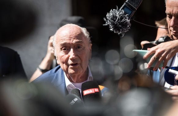 The former Fifa President, Joseph Blatter, center, surrounded by media representatives, speaks to the press in front of the Swiss Federal Criminal Court in Bellinzona, Switzerland, at the last day of  ...