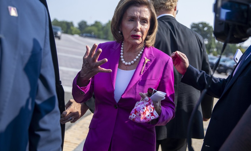 epa09374416 Speaker of the House Nancy Pelosi responds to a question from the news media, following a press conference to call for climate action at the US Capitol in Washington, DC, USA, 28 July 2021 ...