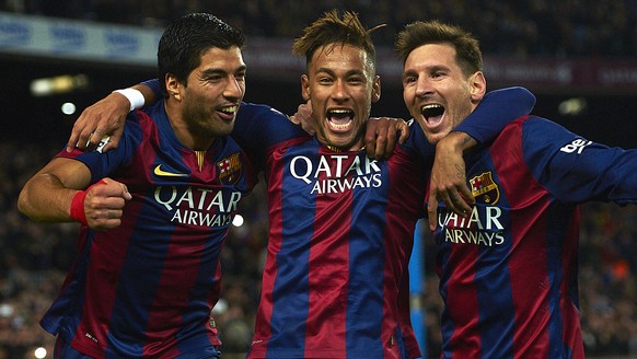 FILE - In this Jan. 11, 2015 file photo, FC Barcelona&#039;s Lionel Messi, from Argentina, right, Neymar, from Brazil, center, and Luis Suarez, from Uruguay, celebrate after scoring against Atletico M ...