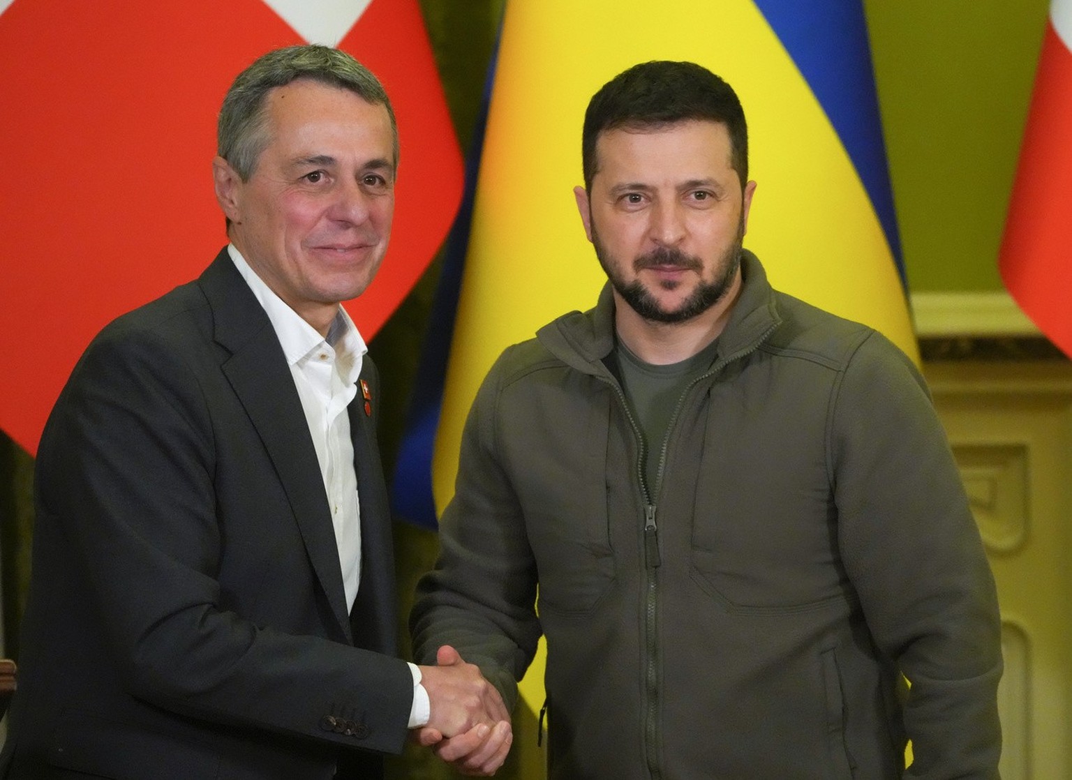 Ukrainian President Volodymyr Zelenskyy, right, shakes hands with Swiss President Ignazio Cassis in Kyiv, Ukraine, Thursday, Oct. 20, 2022. (KEYSTONE/AP Photo/Efrem Lukatsky)