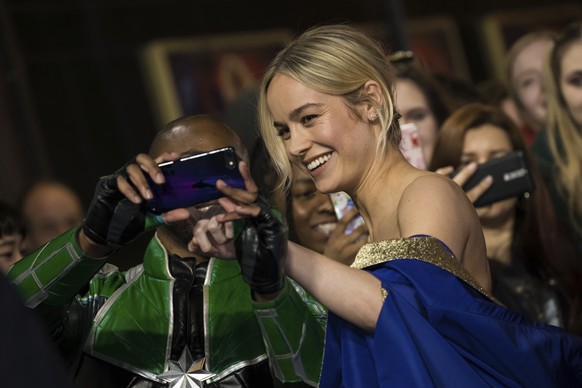 Actress Brie Larson poses for a photograph with a fan upon arrival at the premiere of the film &#039;Captain Marvel&#039;, in London, Wednesday, Feb. 27, 2019. (Photo by Vianney Le Caer/Invision/AP)