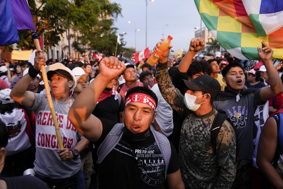 Anti-government protesters march in Lima, Peru, Saturday, Jan. 21, 2023. Protesters are seeking the resignation of President Dina Boluarte, the release from prison of ousted President Pedro Castillo a ...