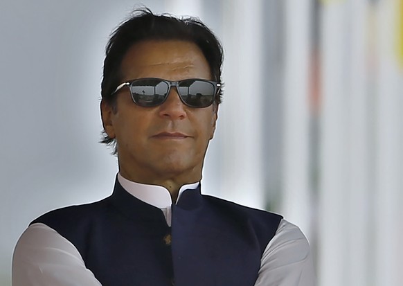 FILE - Pakistan&#039;s Prime Minister Imran Khan attends a military parade to mark Pakistan National Day, in Islamabad, Pakistan on March 23, 2022. Pakistan