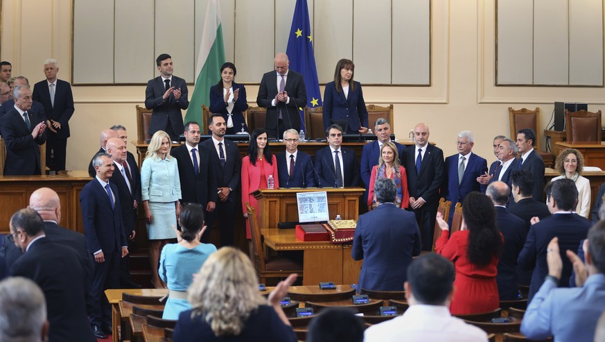 Newly approved Bulgarian Prime Minister Nikolay Denkov and his government is applauded as they took their oath at the Bulgarian Parliament, Tuesday, June 6, 2023, in Sofia. Bulgaria&#039;s parliament  ...