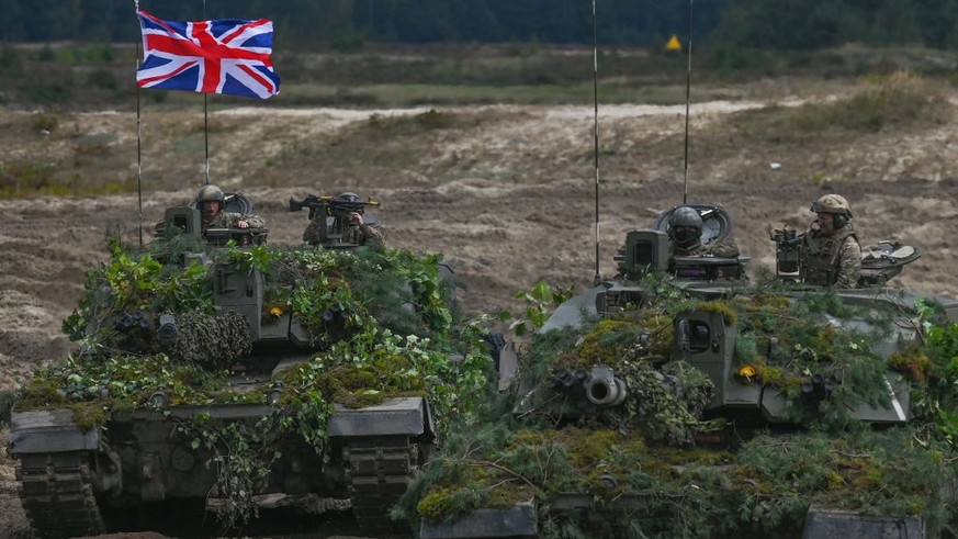British Army Challenger 2 tanks are on display at the training ground in Nowa Deba on September 21, 2022 in Nowa Deba, Subcarpathian, Poland.  Soldiers from Poland, the US and Great Britain take…