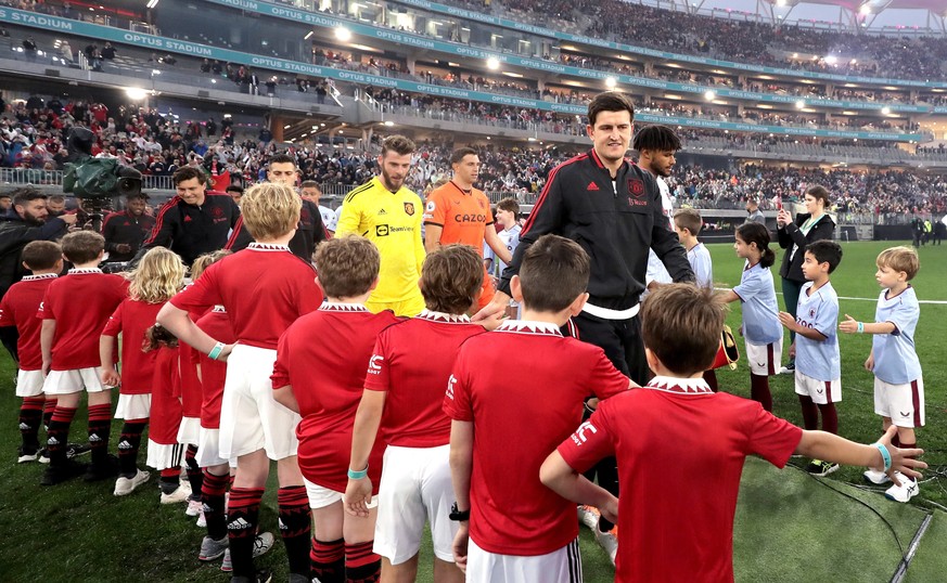 epa10087493 Players enter the pitch before the friendly soccer match between English Premier League sides Manchester United and Aston Villa at Optus Stadium in Perth, Australia, 23 July 2022. EPA/RICH ...