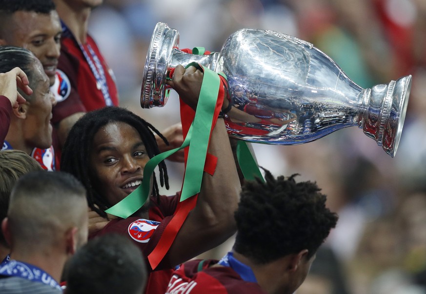 Portugal&#039;s Renato Sanches lifts the trophy after Portugal won the Euro 2016 final soccer match between Portugal and France at the Stade de France in Saint-Denis, north of Paris, Sunday, July 10,  ...