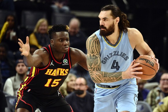 Memphis Grizzlies center Steven Adams (4) handles the ball against Atlanta Hawks center Clint Capela (15) in the first half of an NBA basketball game Friday, Nov. 26, 2021, in Memphis, Tenn. (AP Photo/Brandon Dill)