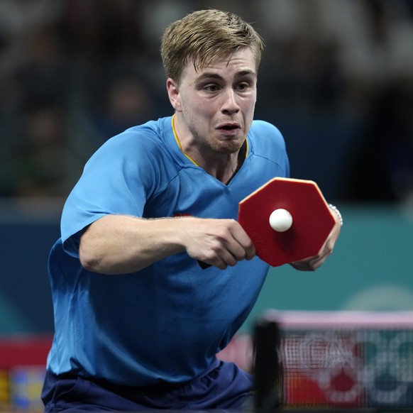Sweden&#039;s Truls Moregrad plays against China&#039;s Wang Chuqin during a men&#039;s singles round of 32 table tennis game at the 2024 Summer Olympics, Wednesday, July 31, 2024, in Paris, France. ( ...
