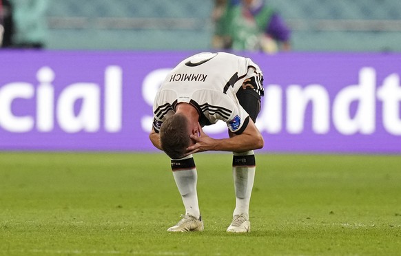 Germany&#039;s Joshua Kimmich reacts after Japan scored during the World Cup group E soccer match between Germany and Japan, at the Khalifa International Stadium in Doha, Qatar, Wednesday, Nov. 23, 20 ...