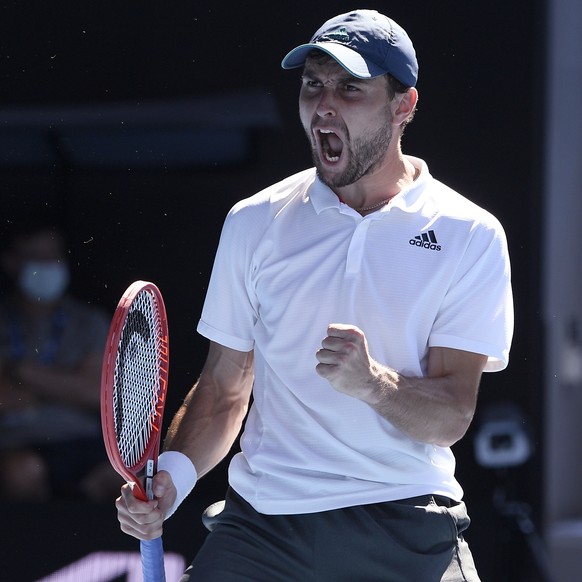 Russia&#039;s Aslan Karatsev celebrates his win over Canada&#039;s Felix Auger-Aliassime in their fourth round match at the Australian Open tennis championships in Melbourne, Australia, Sunday, Feb. 1 ...