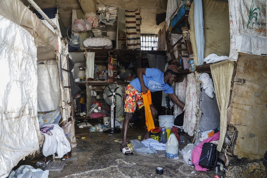 An inmate stands at the National Penitentiary in downtown Port-au-Prince, Haiti, Sunday, March 3, 2024. Hundreds of inmates have fled Haiti&#039;s main prison after armed gangs stormed the facility ov ...