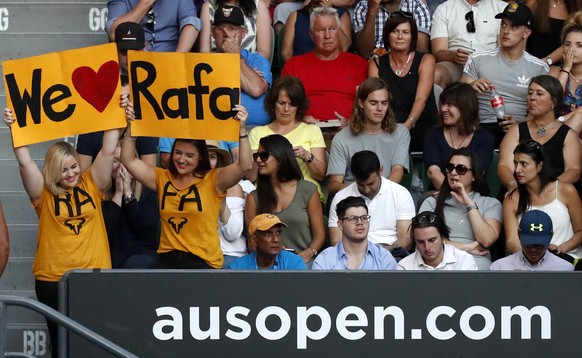 Fans hold up banners in suppor of Spain&#039;s Rafael Nadal during his semifinal against Bulgaria&#039;s Grigor Dimitrov at the Australian Open tennis championships in Melbourne, Australia, Friday, Ja ...