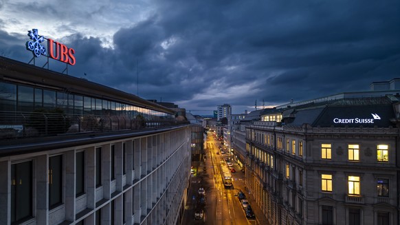 epa11000752 An aerial view shows the headquarters of the Swiss banks Credit Suisse (R) and UBS (L), at Paradeplatz in Zurich, Switzerland, 19 March 2023. The bank UBS takes over Credit Suisse for 2 bi ...