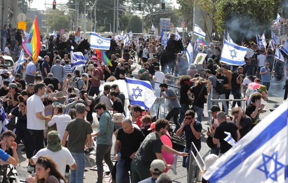 epa10496610 Anti-government demonstrators clash with police as they block the Ayalon Road in the center during an anti-government protest in Tel Aviv, Israel, 01 March 2023. People have been protestin ...