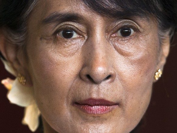 FILE - Myanmar opposition leader Aung San Suu Kyi briefs the media after a meeting with Norway Prime Minister Jens Stoltenberg at the Norway government guest house in Oslo on June 15, 2012. A court in ...