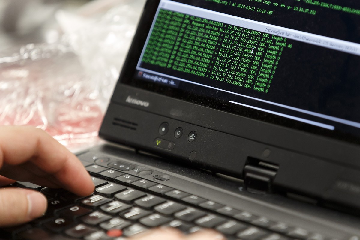 Hackers try to break the security oriented challenges during an ethical hacking contest at the 7th edition of "Insomni'hack - Swiss security conference and ethical hacking contest", in  ...