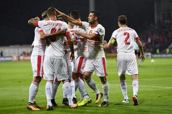 Swiss forward Haris Seferovic, left, celebrates after scoring the goal to the 0:1 with teammates during the 2018 Fifa World Cup group B qualifying soccer match Latvia against Switzerland at Skonto Sta ...