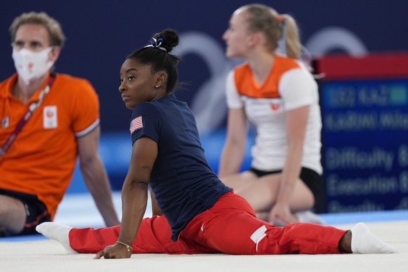 Simone Biles, of the United States, stretches prior to the balance beam final during the artistic gymnastics women&#039;s at the 2020 Summer Olympics, Tuesday, Aug. 3, 2021, in Tokyo, Japan. (AP Photo ...