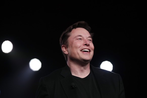 FILE - In this March 14, 2019, file photo Tesla CEO Elon Musk speaks before unveiling the Model Y at Tesla&#039;s design studio in Hawthorne, Calif. Musk says in an internal memo that Tesla has enough ...