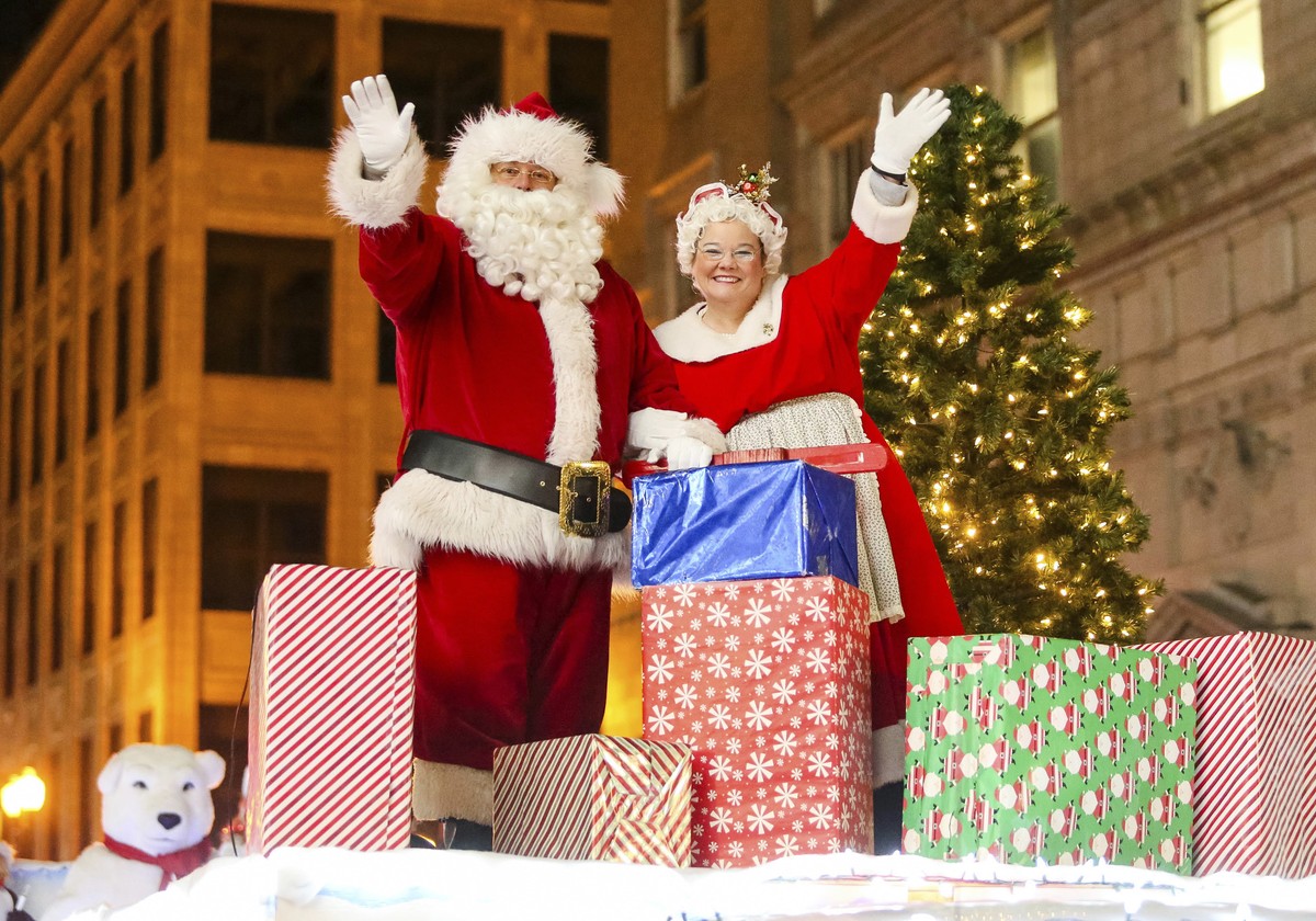 Santa and Mrs. Claus wave to the crowd during Huntington's annual Christmas Parade of Lights on Saturday, Dec. 10, 2016, in downtown Huntington, W.Va. (Sholten Singer/The Herald-Dispatch via AP)