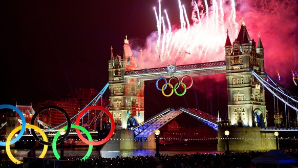 epa05332143 (FILE) Photo dated 27 July 2012 shows fireworks illuminating the sky over the Tower Bridge in London during the Opening Ceremony of the London 2012 Olympic Games, London, Britain. The IOC ...
