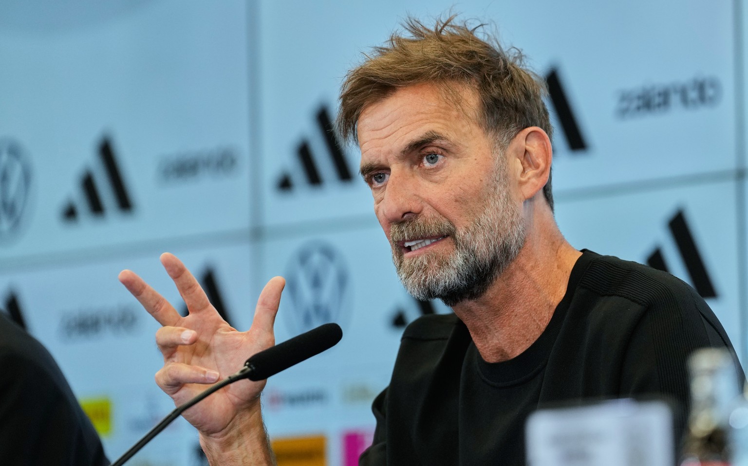 Newly appointed head coach of the German national soccer team Juergen Klopp attends a news conference at the headquarters of the German Football Association DFB in Frankfurt, Germany, Friday, July 24, ...