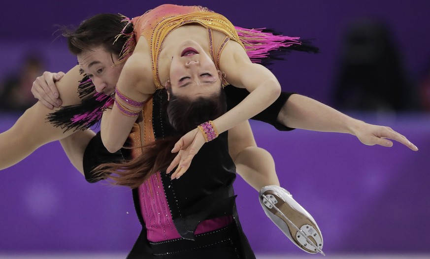 Kana Muramoto and Chris Reed of Japan perform during the ice dance, short dance figure skating in the Gangneung Ice Arena at the 2018 Winter Olympics in Gangneung, South Korea, Monday, Feb. 19, 2018.  ...
