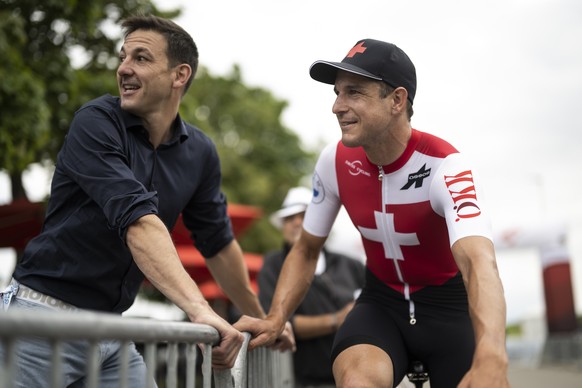 Thomas Peter, Director of Swiss Cycling, left, and Claudio Imhof from Switzerland of Swiss Cycling, right, prior the second stage, a 199 km race from Kuesnacht to Aesch, at the 85th Tour de Suisse UCI ...