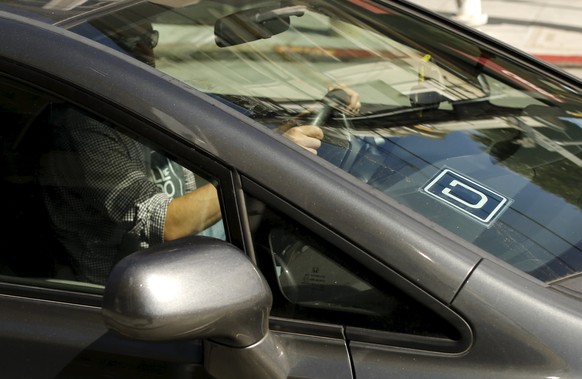 The logo for Uber is shown on a vehicle in San Francisco, California May 7, 2015.REUTERS/Robert Galbraith