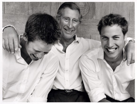 Handout photograph made available Sunday Sept.12, 2004, of Britain&#039;s Prince Charles, the Prince of Wales (centre) with his two sons Prince Harry (left) and Prince William. The photograph has been ...