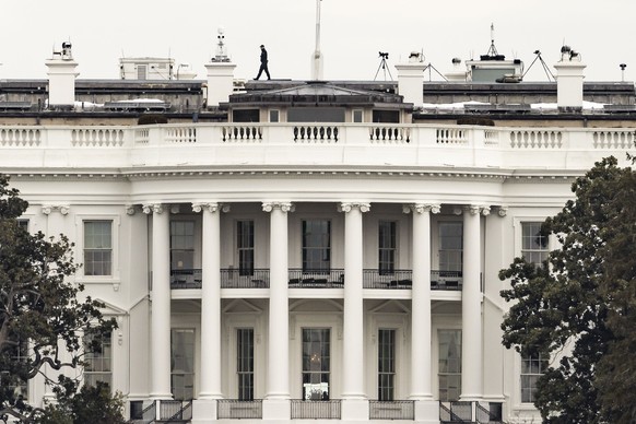 epa11834725 A US Secret Service agent on the roof of the White House in Washington, DC, USA, 18 January 2025. President-elect Donald Trump, who defeated Joe Biden to become the 47th president of the U ...