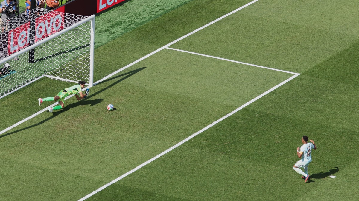 Morocco goalkeeper Yassine Bounou (1) stops a penalty kick against France's Kylian Mbappe (10) during the World Cup quarterfinal soccer match in Foxborough, Mass., near Boston, Thursday, July 9,  ...