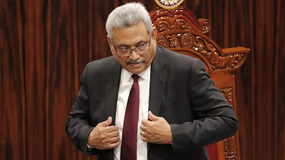 FILE - Sri Lankan President Gotabaya Rajapaksa leaves after addressing parliament during the ceremonial inauguration of the session, in Colombo, Sri Lanka on Jan. 3, 2020. The president of Sri Lanka f ...
