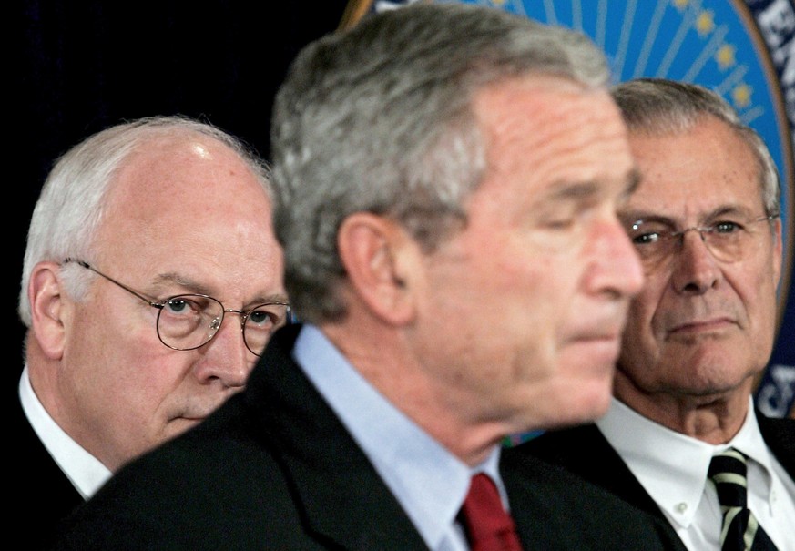 epa09314273 (FILE) - A file picture dated 22 September 2005 of then US President George W. Bush (C) pausing as he speaks on the war on terror as Vice President Dick Cheney (L) and Secretary of Defense ...