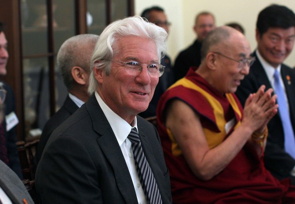 Actor Richard Gere accompanies the Dalai Lama during a meeting with members of Congress, Tuesday, June 14, 2016, on Capitol Hill in Washington. (AP Photo/Lauren Victoria Burke)