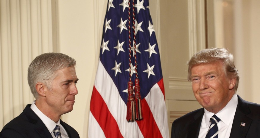 U.S. President Donald Trump and Neil Gorsuch (L) smile as Trump nominated Gorsuch to be an associate justice of the U.S. Supreme Court at the White House in Washington, D.C., U.S., January 31, 2017. R ...