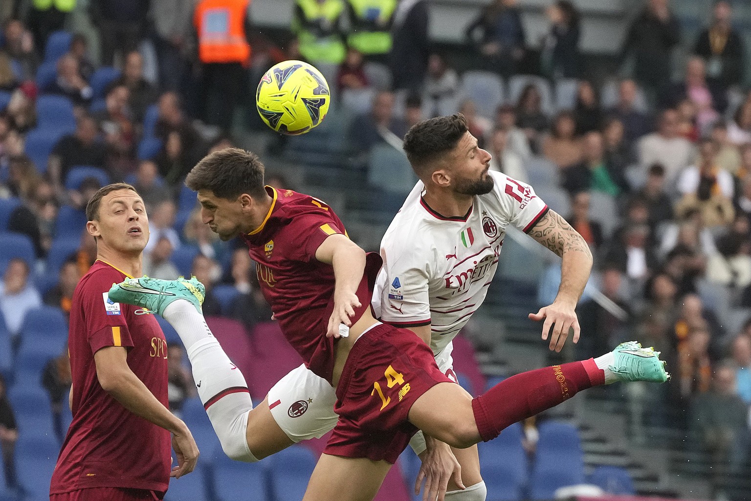 Roma&#039;s Marash Kumbulla, left, and AC Milan&#039;s Olivier Giroud vie for the ball during a Serie A soccer match between Roma and AC Milan, at Rome&#039;s Olympic stadium, Saturday, April 29, 2023 ...