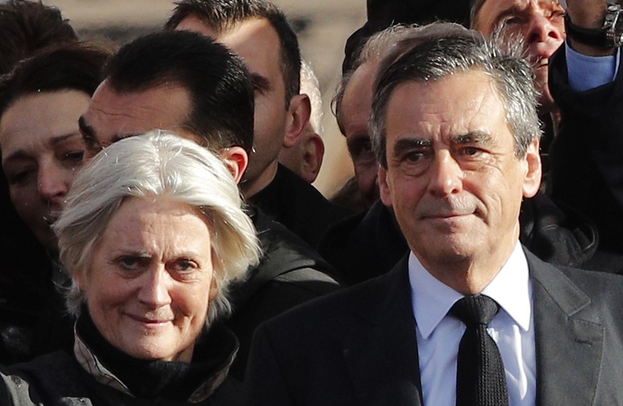 FILE - In this March 5, 2017 file photo, French conservative presidential candidate Francois Fillon and his wife Penelope smile after delivering his speech during a rally in Paris. Penelope Fillon is  ...