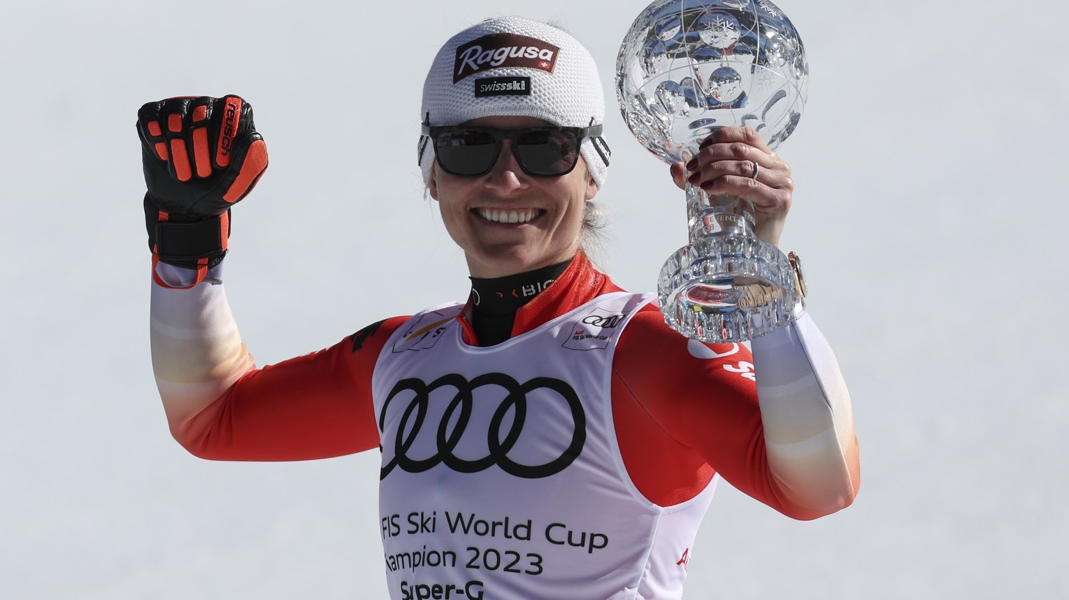 Switzerland&#039;s Lara Gut Behrami holds the alpine ski, women&#039;s World Cup super-g discipline trophy, in Soldeu, Andorra, Thursday, March 16, 2023. (AP Photo/Alessandro Trovati)