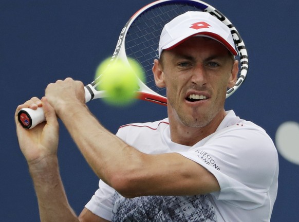 John Millman, of Australia, returns a shot to Mikhail Kukushkin, of Kazakhstan, during the third round of the U.S. Open tennis tournament, Saturday, Sept. 1, 2018, in New York. (AP Photo/Kevin Hagen)